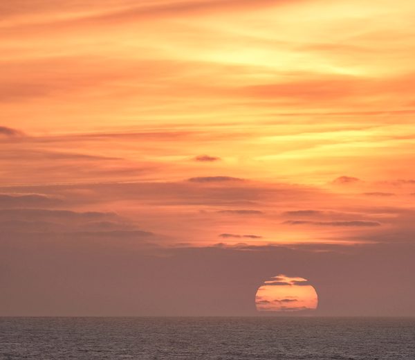Scenic golden sunset ocean beach photo kept with Swipe Photo Cleaner